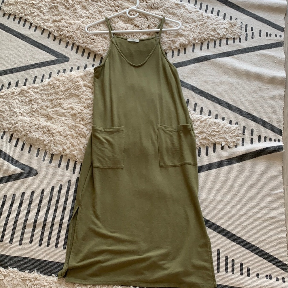 Cherish women’s avocado green slit dress with pockets.